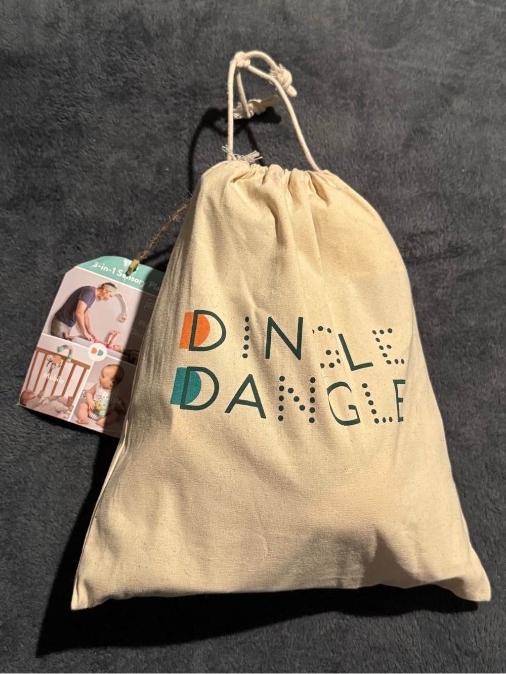 DINGLE DANGLE
Diaper Changing Headband & Mobile for Crib, Pushchair or Car Seat